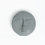 Phiz- Dark Concrete Round Face shaped Paper Weight for a work desk, office, and study table.